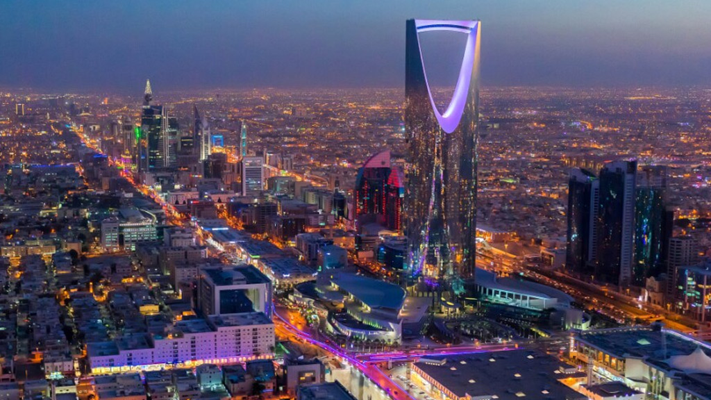 Why is it prohibited to buy property in Mecca and Medina