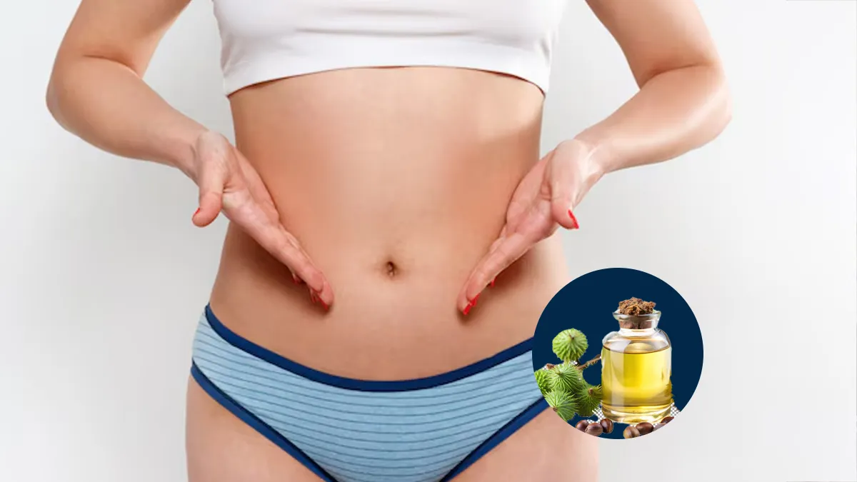 applying castor oil on belly button