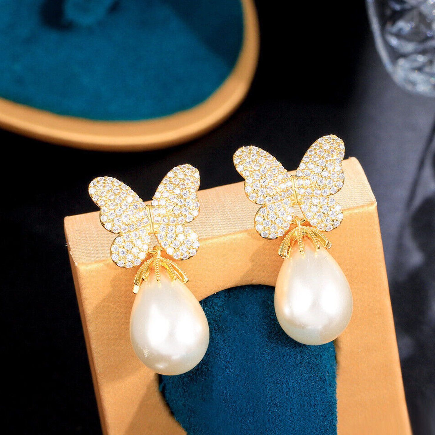 pearl and stone plated butterfly earring design