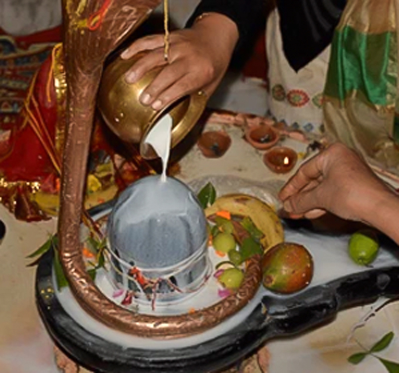 offering milk to lord shiva