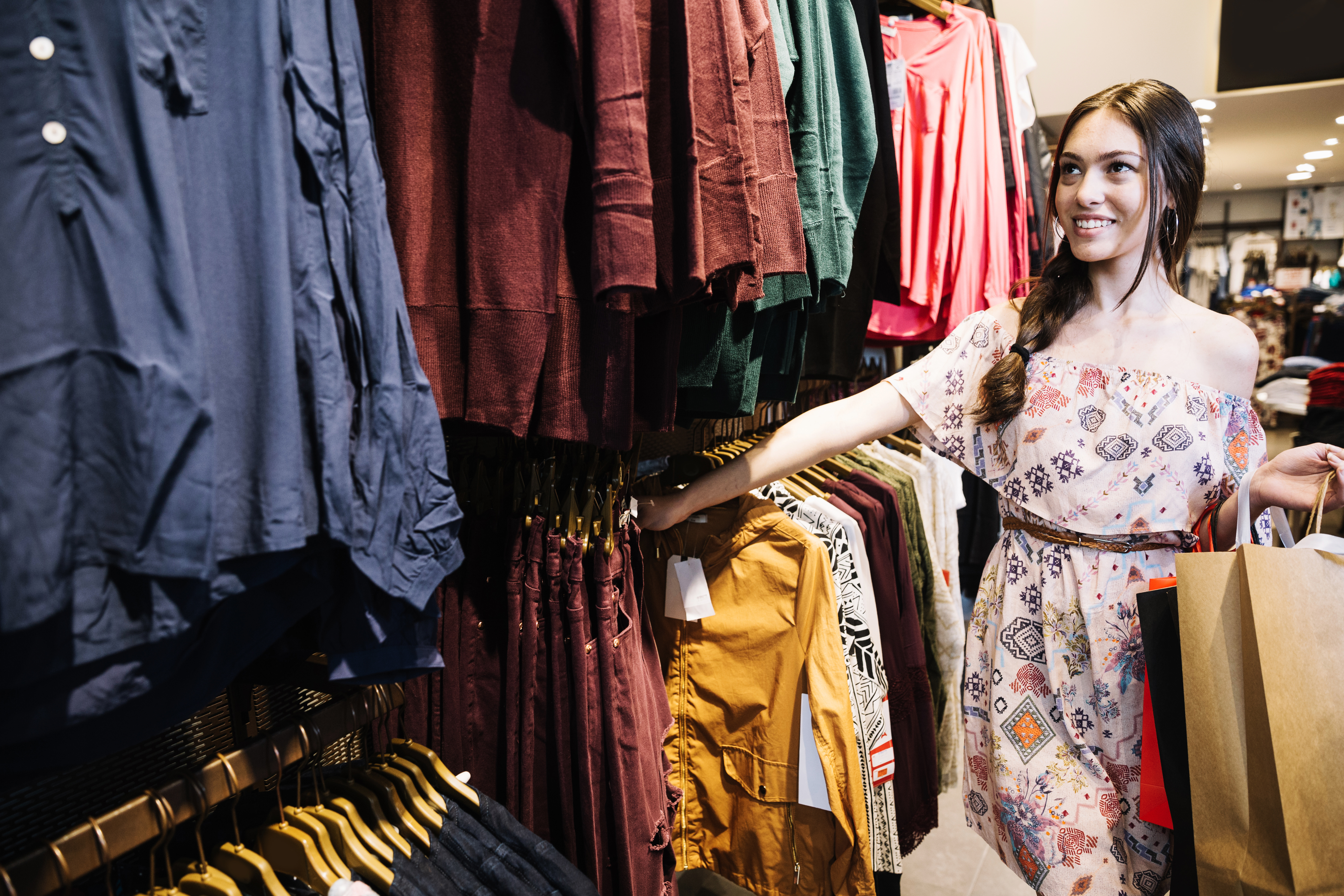 content-model-choosing-clothes-shop