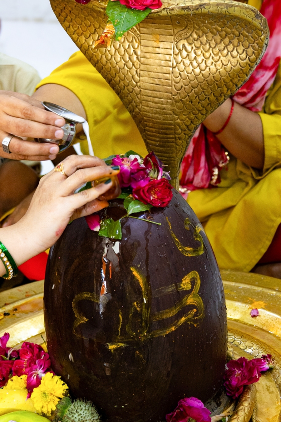 offering honey and water to lord shiva