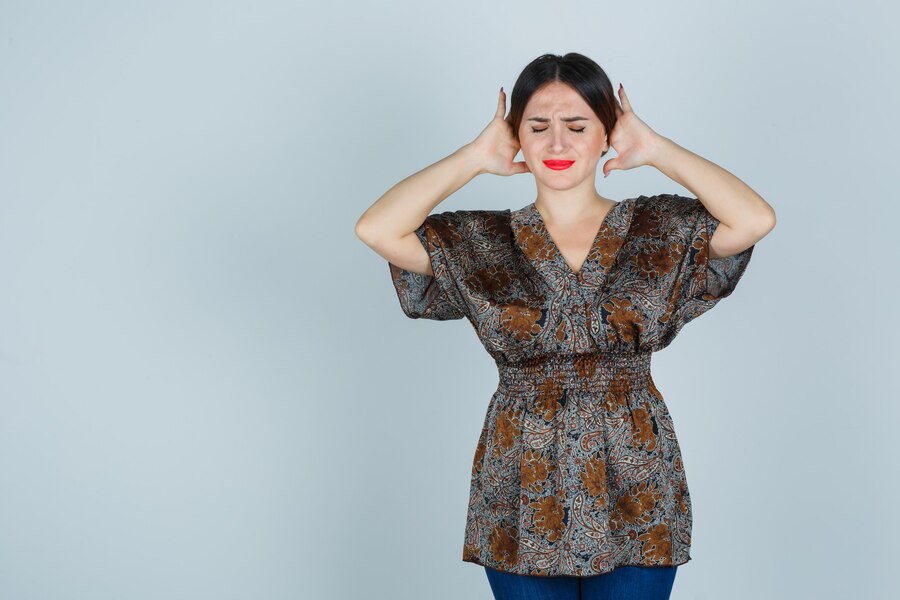 expressive-young-woman-posing-studio_176474-35301