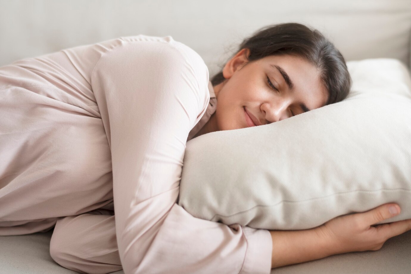 woman-sleeping-comfortably-her-pillow_53876-127228