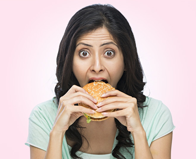 women eating junk food inside