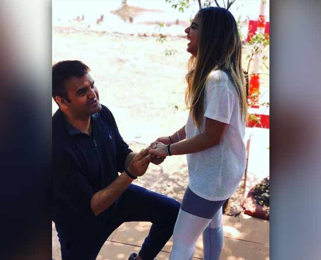 business mukesh ambanis daughter isha ambani gets engaged to anand piramal in