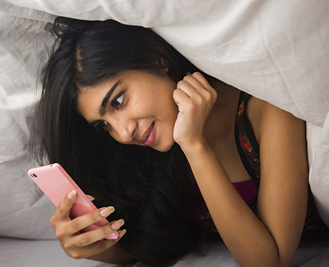 women checking mobile inside