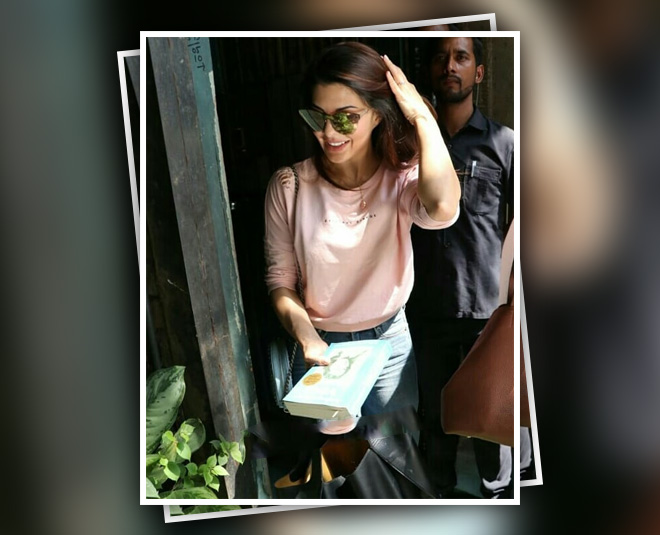 jacqueline fernandez with book autobiography of a yogi