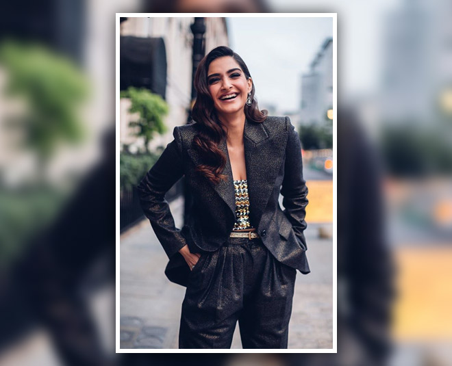 actress who gives boss  lady look in black suit INSIDE 