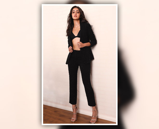 actress who gives boss  lady look in black suit INSIDE 