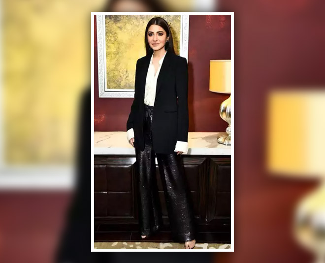 actress who gives boss  lady look in black suit INSIDE 