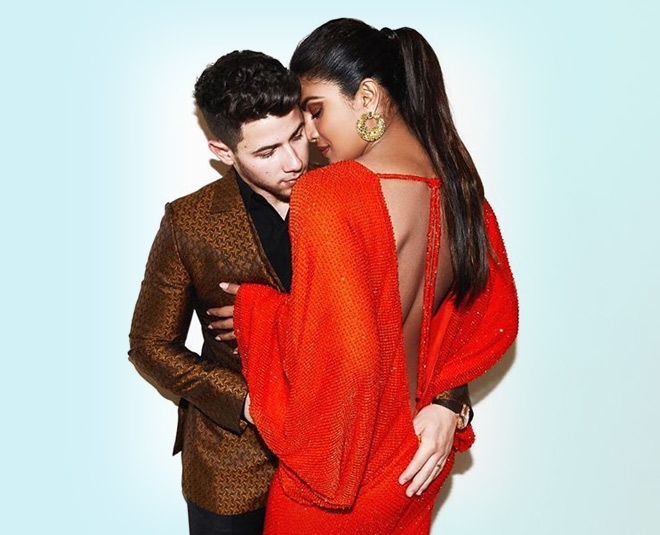 nick jonas thumb inside priyanka chopra orange dress cannes 