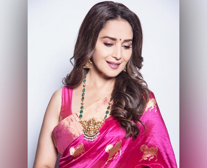 madhuri dixit wearing gold pendant ganesha