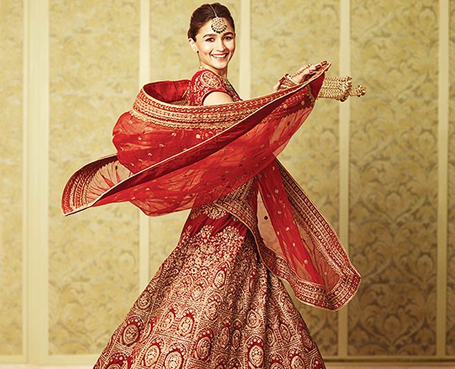 WeddingSutra - Be the belle of the ball at your wedding in this vibrant  lehenga with intricate embroidery from Mohey! For more details, visit  https://www.manyavar.com/mohey #redlehenga #Mohey #MoheyLehenga #MoheyBride  #Bridal #Lehenga #WeddingWear #