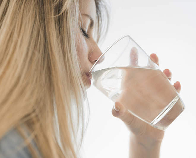 someone taking a sip of water stock image