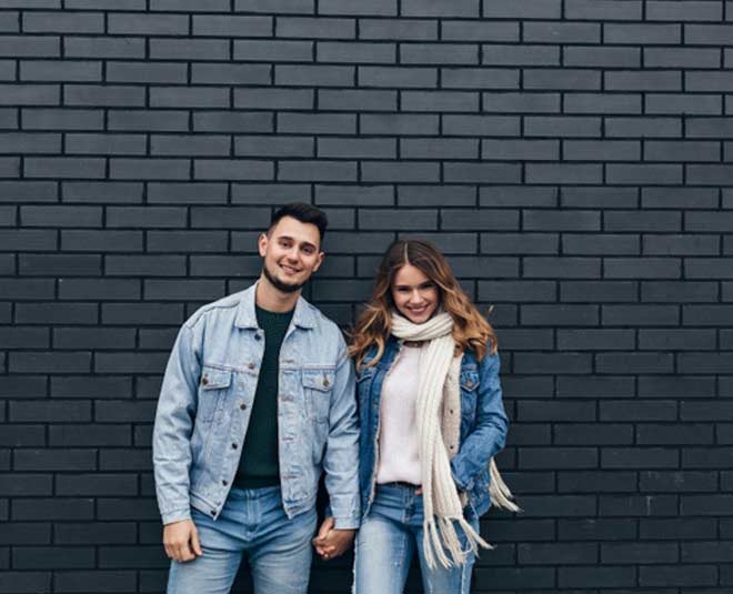 couple standing together inside 