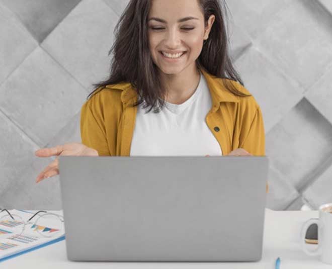 woman working with laptop inside 