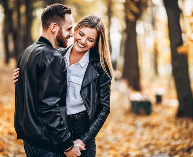 young loving couple hugging inside 