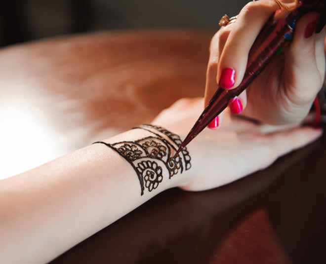 Process of applying mehndi on female hands Stock Photo | Adobe Stock