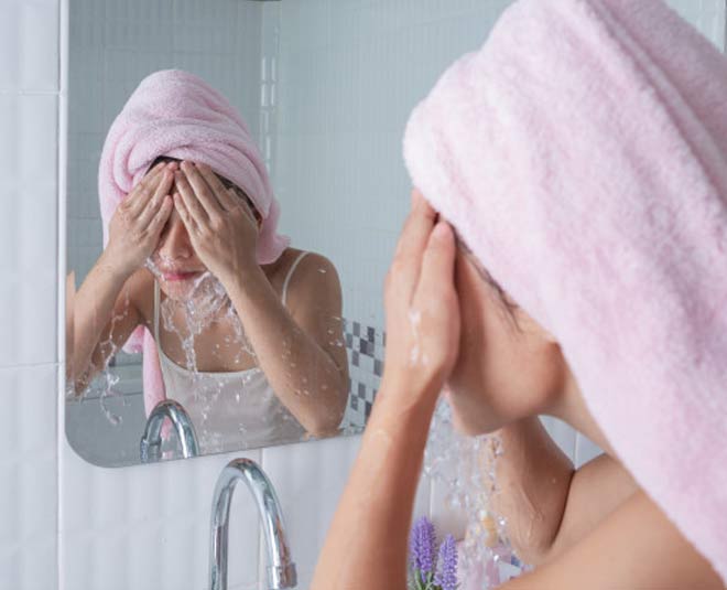 girl washes face inside 