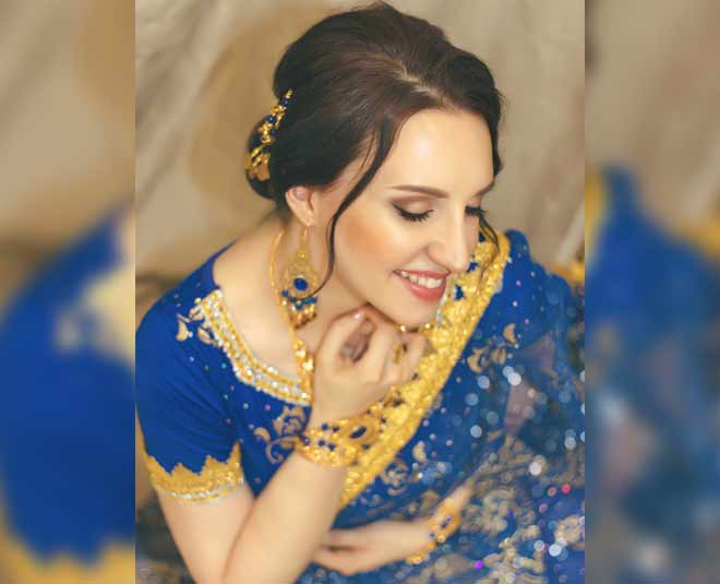 beautiful woman blue indian sari inside