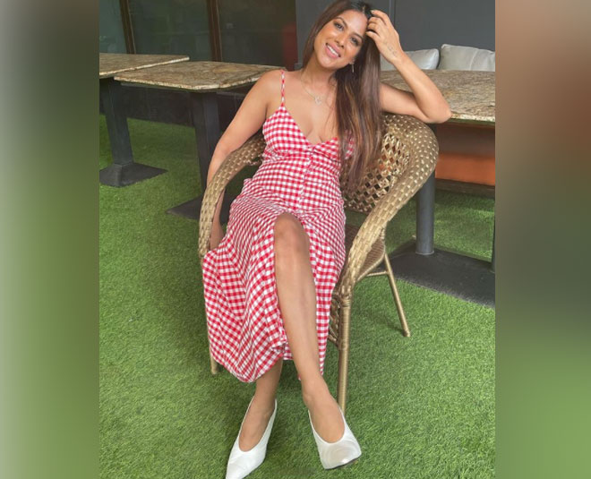 nia sharma red white check dress