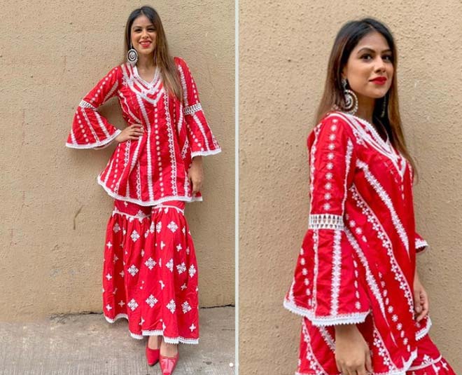 nia sharma red white suit