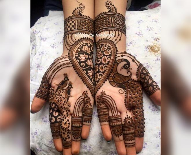 Shreya - Mehendi Artist - Satiate the die-hard romantic soul in you by  getting some romantic elements in your full hand mehndi design. Along with  the portrait of Lord Shiva and Goddess