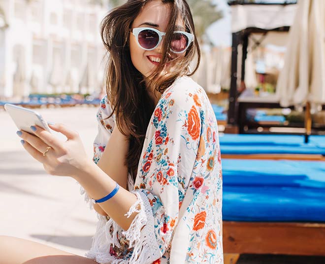 Girl in sunglasses on shore - a Royalty Free Stock Photo from Photocase