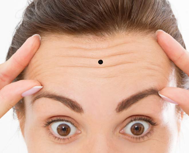 moles  on  forehead meaning