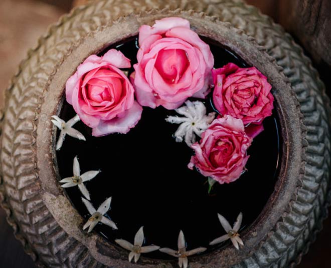 water with flower in main door