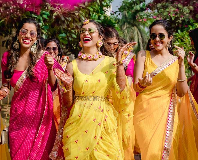 Indian bride and groom posing on their pre-wedding Haldi outfits. | Photo  321022