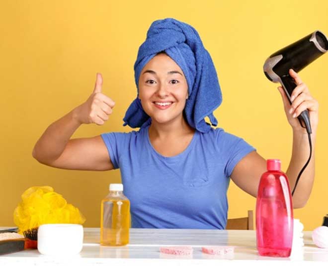 woman holding jar hair oil her hands inside 
