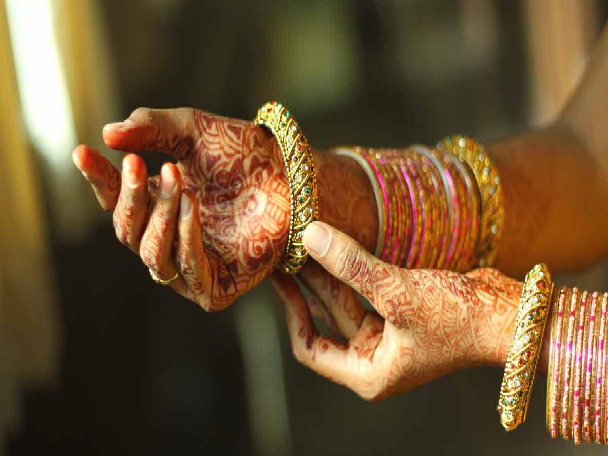 man wearing bangles