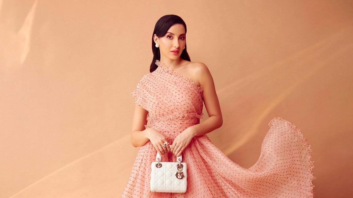 How much do you think Nora Fatehi's white bag costs? - Times of India
