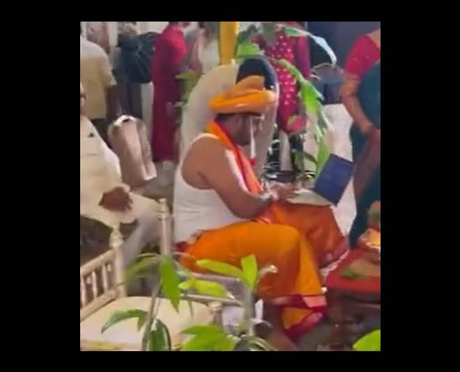 groom working from mandap