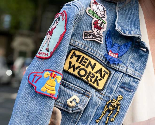 Denim jacket with stickers. Stock Photo | Adobe Stock