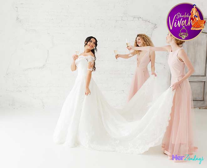 bride in a wedding gown and bridesmaids