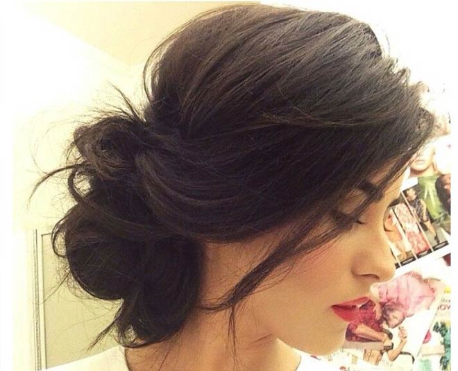 messy side bun hairstyle