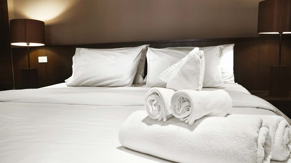 hotel room white bedsheets