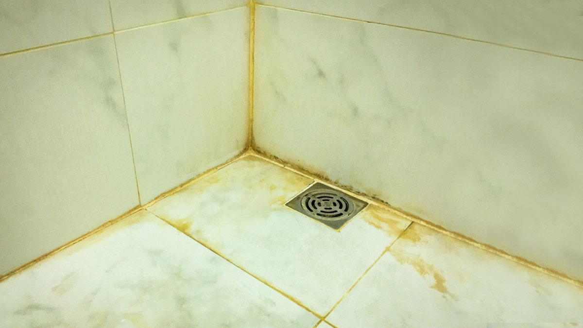 how to clean bathroom tiles yellow stain