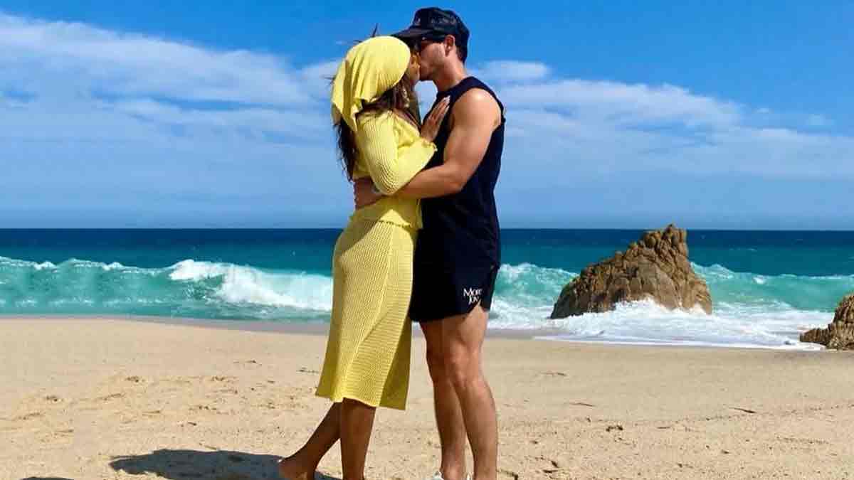 Kevin Jonas and wife Danielle kiss on the beach at cousin's