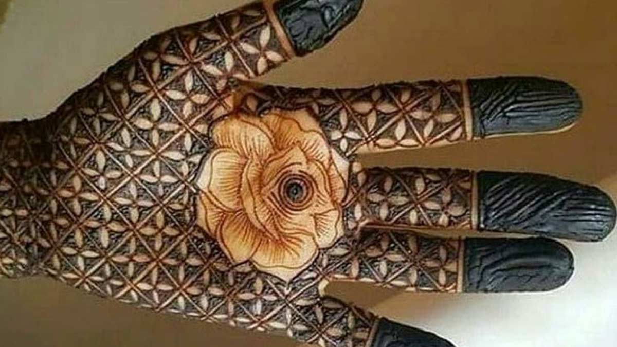 Henna Tattoos and Flowers on Woman Hands · Free Stock Photo