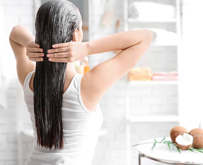 woman applying hair conditioner