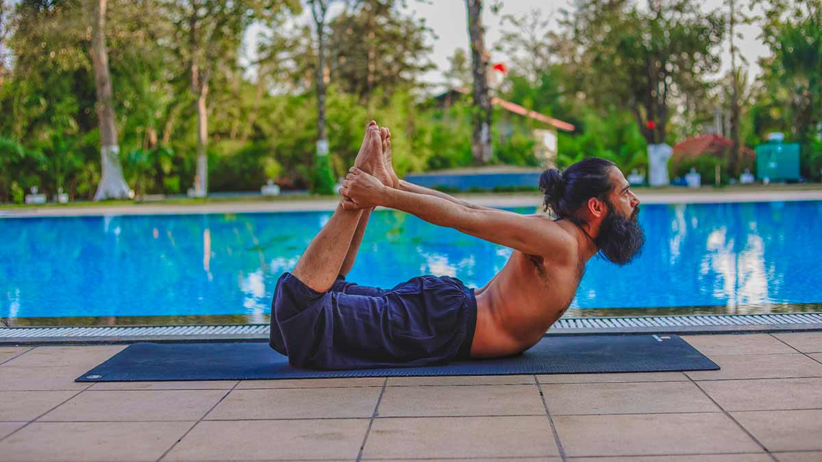 Dhanurasana for belly fat