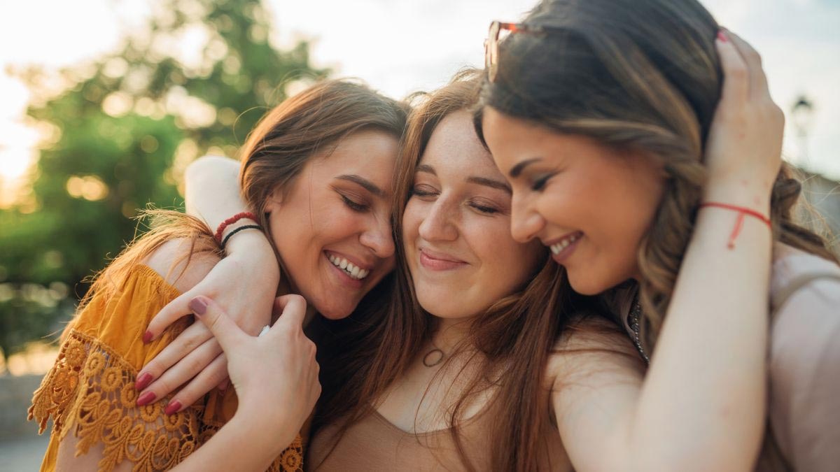 Best friends three teen girls group on white background Stock Photo - Alamy