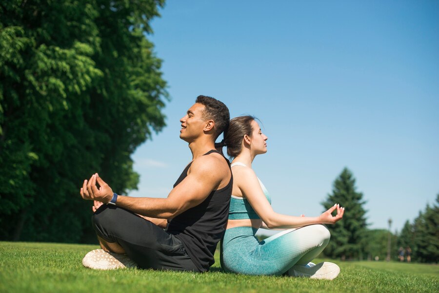 man woman practicing yoga outdoor  