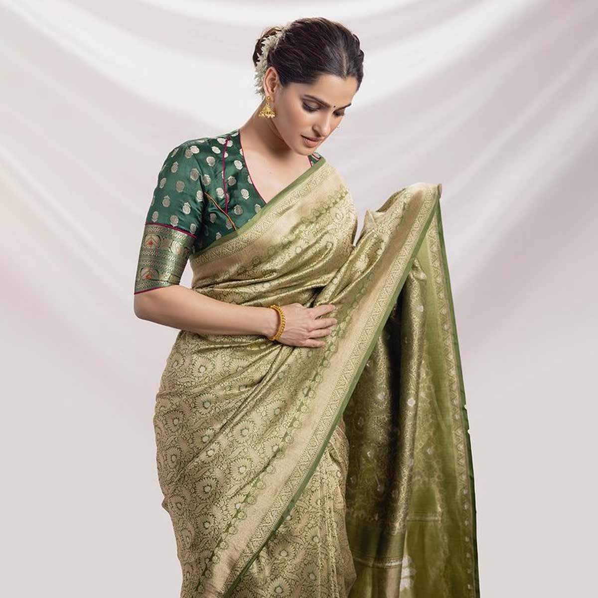 Style like a Bollywood actress on a green teej with a green saree