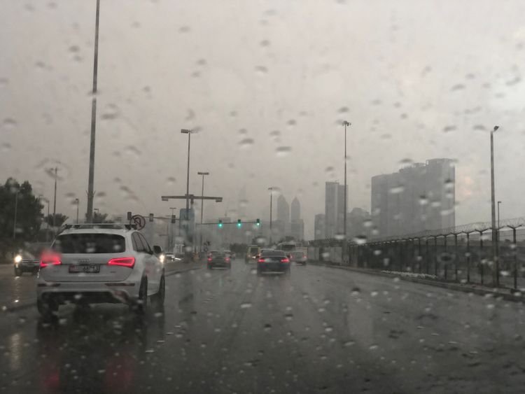 Should you turn your hazard lights when driving in the rain