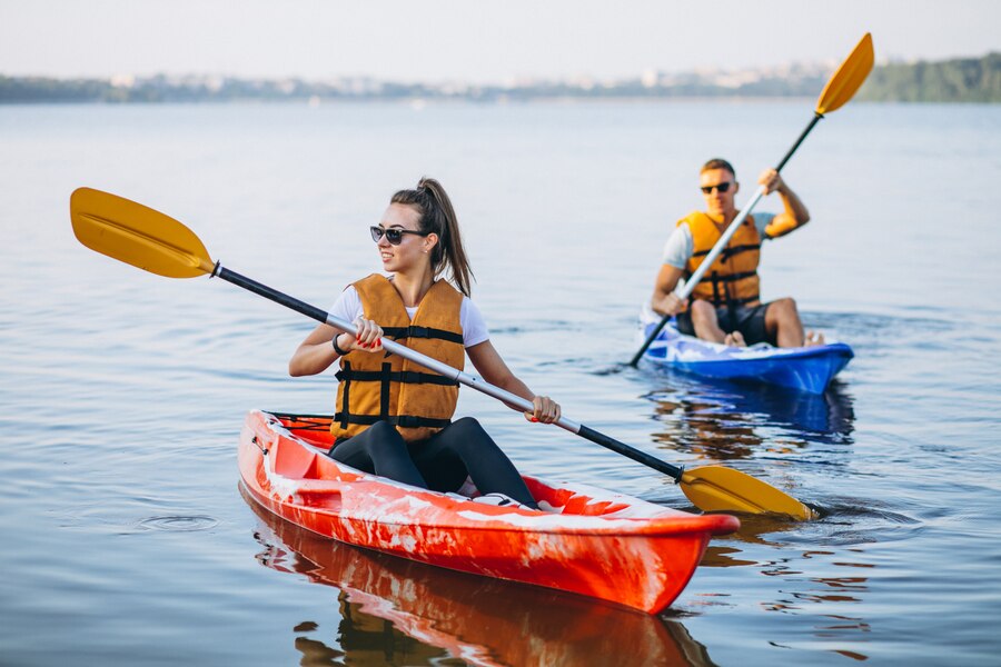 couple together kayaking river  